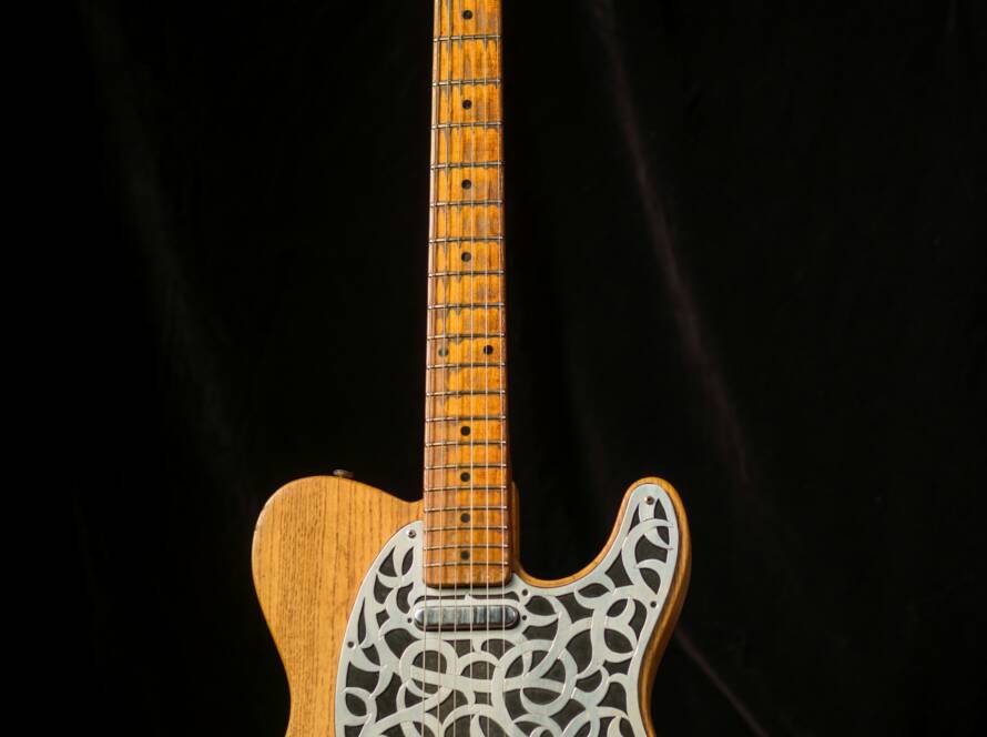 Vintage electric guitar with classic hardware and pickguard